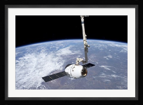Framed SpaceX Dragon Cargo Craft in the Grasp of the Canadarm2 Print