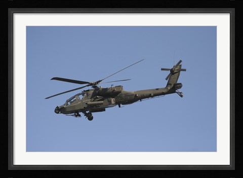 Framed AH-64 Apache in flight over the Baghdad Hotel in central Baghdad, Iraq Print