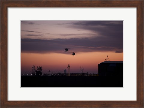 Framed pair of UH-60 Black Hawk helicopters approach their Landing in Baghdad, Iraq Print