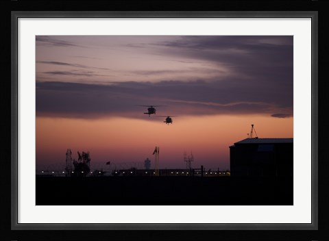 Framed pair of UH-60 Black Hawk helicopters approach their Landing in Baghdad, Iraq Print
