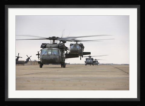 Framed UH-60 Black Hawks taxis out for a mission over northern Iraq Print