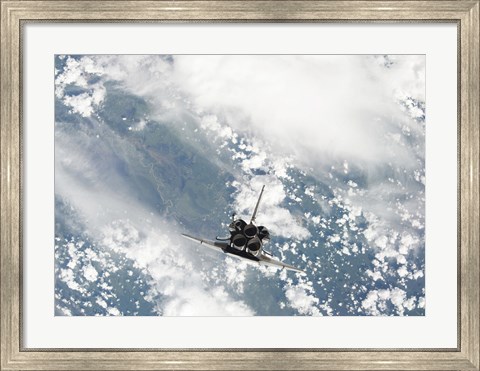 Framed Rear view of the Three main Engines of Space Shuttle Discovery as the Shuttle approaches the International Space Station Print
