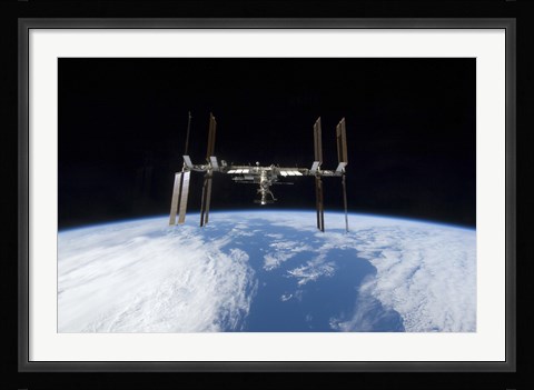 Framed International Space Station backdropped by Earth's Horizon Print
