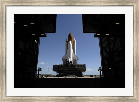 Framed Atlantis Rolls Toward the Open Doors of the Vehicle Assembly Building at Kennedy Space Center Print