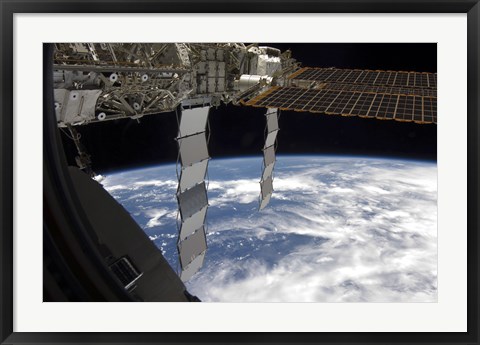 Framed International Space Station Backdropped Againts a Blue and White Earth Print