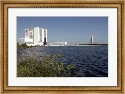 Framed Viewed across the Basin, Space Shuttle Atlantis Crawls Toward the Launch Pad Print