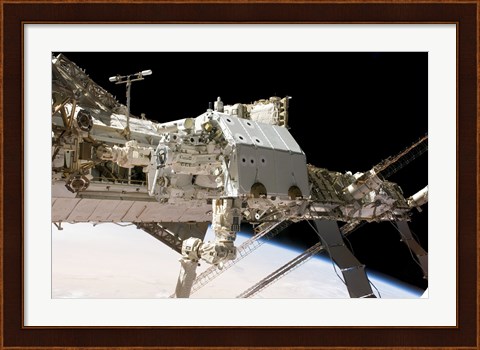Framed Canadian-Built Dextre Robotic System in the Grasp of the Robotic Canadarm2 Print