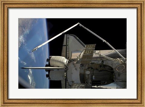 Framed Soyuz Vehicle and the Space Shuttle Discovery Docked to the International Space Station Print