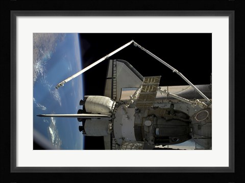 Framed Soyuz Vehicle and the Space Shuttle Discovery Docked to the International Space Station Print
