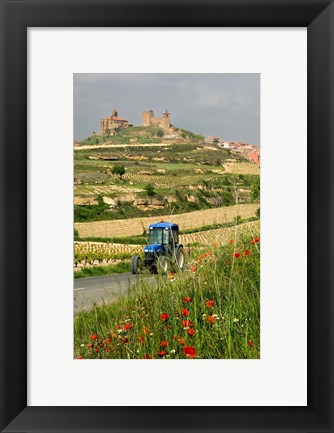 Framed Blue tractor on rural road, San Vicente de la Sonsierra Village, La Rioja, Spain Print