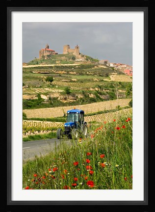 Framed Blue tractor on rural road, San Vicente de la Sonsierra Village, La Rioja, Spain Print