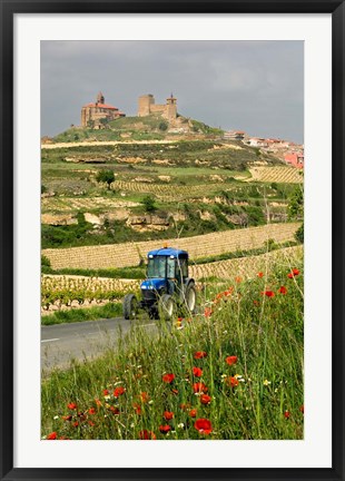 Framed Blue tractor on rural road, San Vicente de la Sonsierra Village, La Rioja, Spain Print