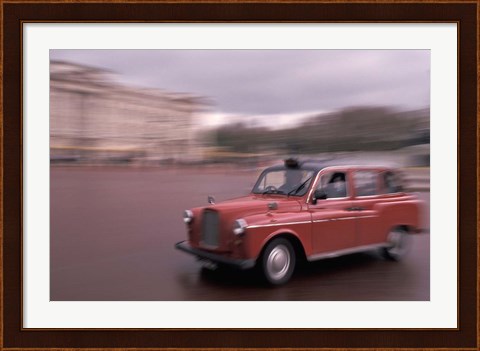 Framed Cab racing past Buckingham Palace, London, England Print