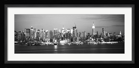 Framed Skyscrapers lit up at night in a city, Manhattan, NY Print