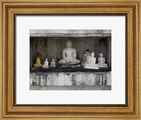 Framed Niche at Ruwanwelisaya Dagoba filled with Buddha statues as offerings, Anuradhapura, Sri Lanka Print