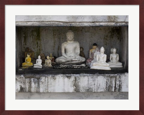 Framed Niche at Ruwanwelisaya Dagoba filled with Buddha statues as offerings, Anuradhapura, Sri Lanka Print