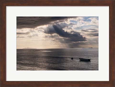 Framed Dramatic light over a little boat, Mamanucas Islands, Fiji, South Pacific Print