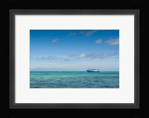 Framed Fishing boat in the turquoise waters of the blue lagoon, Yasawa, Fiji, South Pacific Print