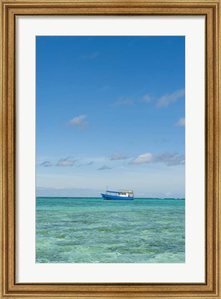 Framed Fishing boat in the turquoise waters of the blue lagoon, Fiji Print