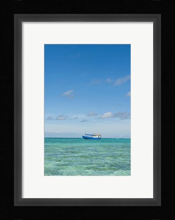 Framed Fishing boat in the turquoise waters of the blue lagoon, Fiji Print