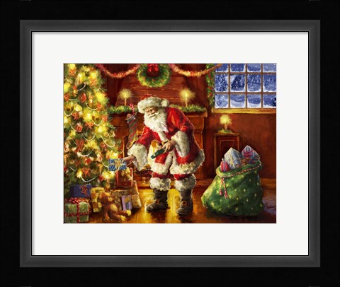 Framed Santa putting gifts under tree Print