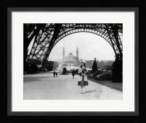 Framed 1920s Woman Walking Under The Eiffel Tower Print