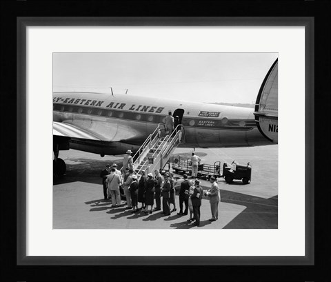 Framed 1950s Group Of Passengers Boarding Airplane Print
