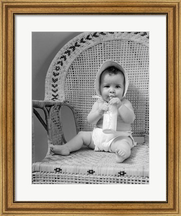 Framed 1940s Baby Sitting In Wicker Chair Print