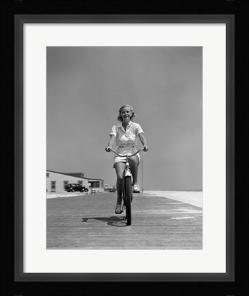Framed 1940s Summer Time Smiling Woman Riding Bike On Beach Boardwalk Print