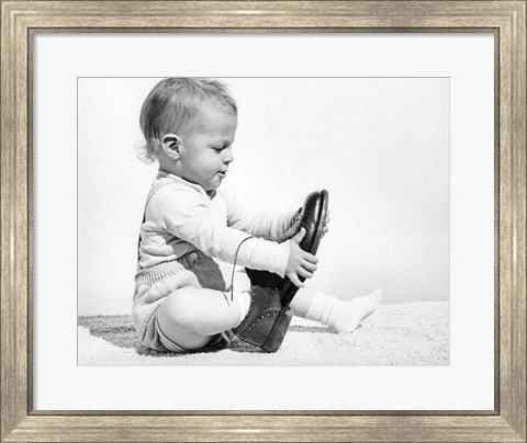 Framed 1960s Baby Boy Trying To Put On Man&#39;S Shoe Print
