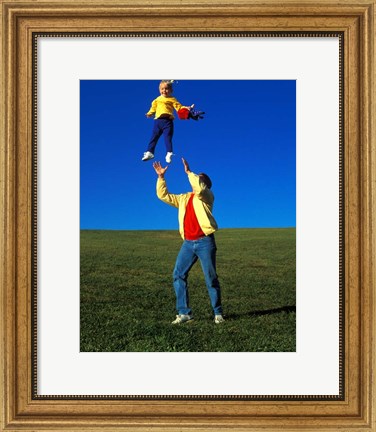 Framed 1990S Father Tossing Daughter Up In The Air Print