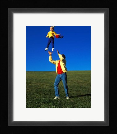 Framed 1990S Father Tossing Daughter Up In The Air Print